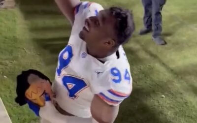 Conquered: Florida Gators celebrate 31-11 win FSU in style with Seminole head, flag plant and turf ripping